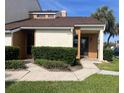 Inviting townhome featuring a manicured lawn, walkway, and a welcoming front entrance at 3002 Clubview Dr, Orlando, FL 32822