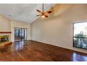 Bright living room featuring hardwood floors, a fireplace, and a sliding door that fills the space with light at 3002 Clubview Dr, Orlando, FL 32822