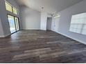 Spacious living room with vinyl plank flooring and large windows at 3027 Eagle Lake Dr, Orlando, FL 32837