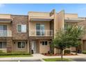 Modern townhome with stone exterior and landscaped walkway at 3224 Brasilia Ave # 3224, Kissimmee, FL 34747