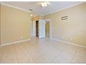 Bedroom with tile flooring, ceiling fan, access to closet and an ensuite bathroom at 337 Fern Lake Dr, Orlando, FL 32825