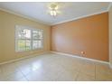 Bright bedroom with tile flooring, a ceiling fan, and large windows offering natural light at 337 Fern Lake Dr, Orlando, FL 32825