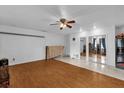 Bright bedroom with wood-look floors and mirrored closet doors at 3717 Jericho Dr, Casselberry, FL 32707