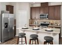 Modern kitchen with stainless steel appliances and an island at 4662 Homestead Trl, St Cloud, FL 34772