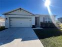 One-story home with attached garage and neat landscaping at 617 Finn Ave, Auburndale, FL 33823