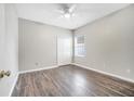 Spacious bedroom with hardwood floors and ample closet space at 116 Whispering Pines Way, Davenport, FL 33837