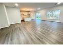 Spacious living area with gray vinyl flooring and lots of natural light at 1211 Baltic Dr Dr, Poinciana, FL 34759