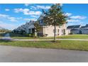 Side view of townhome showing building exterior and landscaping at 13715 Bressler Aly, Windermere, FL 34786