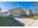 Lovely single-story home boasting a well-manicured lawn and a convenient two-car garage at 1470 Silverado Flats St, Kissimmee, FL 34744