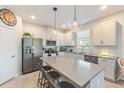 Modern kitchen boasts ample counter space, stainless steel appliances, and an island at 1860 Black Maple Pl, Ocoee, FL 34761