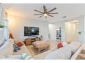 Relaxing living room features comfortable seating and a large TV at 1860 Black Maple Pl, Ocoee, FL 34761