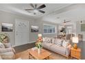Staged living area featuring stylish furnishings, hardwood floors and bright natural light at 2106 Cordova Dr, Sanford, FL 32771