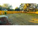 Large fenced backyard with grassy area at 2120 Waitman Ave, Leesburg, FL 34748