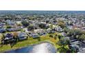 Community overview featuring houses and a lake at 2446 Leaning Pine Ln, Oviedo, FL 32765