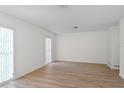 Bright and airy living room featuring wood flooring and light neutral paint at 2823 Cady Way, Winter Park, FL 32792