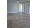 Bright bedroom with gray vinyl flooring and ceiling fan at 4220 Lancashire Ln, Orlando, FL 32812