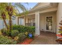 Inviting front porch with rocking chairs and brick walkway at 452 Misty Oaks Run, Casselberry, FL 32707