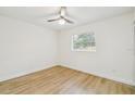 Spacious bedroom with light walls and wood-look flooring at 5216 Bonnie Brae Cir, Orlando, FL 32808