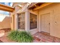 Front entrance with bay window and terracotta tile walkway at 706 Santa Cruz Ln # 706, Howey In The Hills, FL 34737