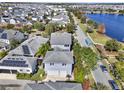 Two-story house with gray exterior, solar panels, and a large backyard at 8758 Pinter St, Orlando, FL 32827