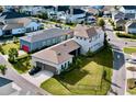 Aerial view showing a house with detached garages and a large backyard at 9062 Sperry St, Orlando, FL 32827