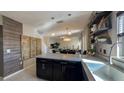 Modern eat-in kitchen featuring stainless steel appliances, pendant lighting and a center island at 376 Willet St, Haines City, FL 33844