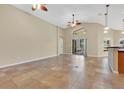 Bright and airy living room with vaulted ceilings and tile floors at 140 Gladesdown Ct, Deland, FL 32724