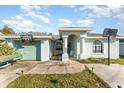 House with green exterior, driveway, and basketball hoop at 1424 Sheridan Sw St, Winter Haven, FL 33880