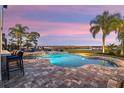 Resort-style pool and patio with sunset views at 15863 Burch Island Ct, Winter Garden, FL 34787