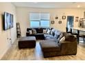 Living room with sectional sofa and large TV at 1904 Tohoqua Blvd, Kissimmee, FL 34744