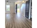 Bright and spacious entryway with light wood-look flooring at 233 Gladiola Ct, Poinciana, FL 34759