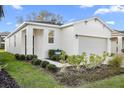 Inviting home with manicured landscaping and a convenient two-car garage at 2523 Avalon Park Blvd, Tavares, FL 32778