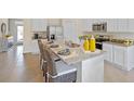 Modern kitchen with white cabinets, granite countertops, and stainless steel appliances at 2994 Salisbury Ave, Haines City, FL 33844