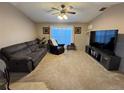 Spacious living room with large TV and comfortable seating at 3054 Shallowford St, Deltona, FL 32738