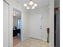 Bright entryway with tile floors and view of bedroom at 313 Dirksen Dr # B16, Debary, FL 32713