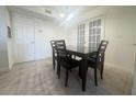 Dining area featuring a dark wood table with four chairs at 429 Fountainhead Cir # 122, Kissimmee, FL 34741