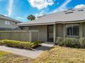 Exterior view of condo with landscaped grounds and walkway at 4409 Prairie Ct # A, Orlando, FL 32808