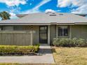 Exterior view of condo with landscaped grounds and walkway at 4409 Prairie Ct # A, Orlando, FL 32808