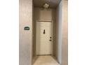 Condo entrance with white door and green number 2109 at 4865 Cypress Woods Dr # 2109, Orlando, FL 32811