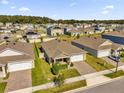 Aerial view of a residential neighborhood with houses and yards at 5372 Palomino Pl, Apopka, FL 32712