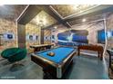 Basement game room with pool table, foosball, and air hockey at 5452 Misty Oak Cir, Davenport, FL 33837