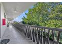 Long hallway with view of trees and landscaping at 700 Melrose Ave # A 22, Winter Park, FL 32789