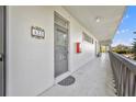 Building hallway with door to unit and fire extinguisher at 700 Melrose Ave # A 22, Winter Park, FL 32789