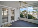 Cozy screened porch with view of the community at 711 Dolphin Dr, Tavares, FL 32778