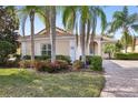 Beautiful home with lush tropical landscaping and tile roof provides curb appeal at 12161 Obelia Ln, Orlando, FL 32827
