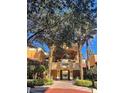 Covered walkway leading to pool and building entrance at 12539 Floridays Resort Dr # 210D, Orlando, FL 32821