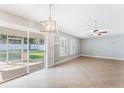 Living room with sliding glass doors leading to a patio at 131 Bristol Forest Trl, Sanford, FL 32771