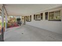 Spacious covered porch with concrete flooring at 145 Verbena Dr, Orlando, FL 32807