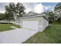 White garage door and concrete driveway at 16391 Sw 17Th Terrace Rd, Ocala, FL 34473