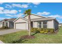 Two-story house with a two-car garage and manicured landscaping at 2025 Havasu Falls Ave, Deland, FL 32724